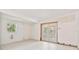 A room showing sliding door to a enclosed patio and tile floors at 441 Kentia Rd, Casselberry, FL 32707