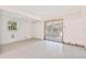 Unfinished room showing sliding door to an enclosed patio at 441 Kentia Rd, Casselberry, FL 32707