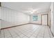 Bright living room with tile floors, a ceiling fan, and a welcoming entrance at 4805 Jay Dr, St Cloud, FL 34772