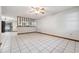 Spacious living room with tile floors, a ceiling fan, and a bright, open layout at 4805 Jay Dr, St Cloud, FL 34772