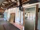 Renovated interior showcasing exposed brick and unfinished drywall, offering potential for customization and design at 4950 Silver Star Rd, Orlando, FL 32808