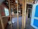 Large commercial space needing updates, featuring exposed framework, original floor, and small side windows at 4950 Silver Star Rd, Orlando, FL 32808