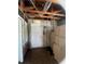 Unfinished room with an exterior door, showing potential for a storage or utility area at 4950 Silver Star Rd, Orlando, FL 32808