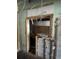 Renovation view showing door frame and wall with exposed building materials, needing structural updates at 4950 Silver Star Rd, Orlando, FL 32808