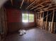 Renovation project in commercial space, showing original floor, exposed wooden beams, and window view at 4950 Silver Star Rd, Orlando, FL 32808
