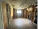 Commercial space in need of renovations with block walls, original floors, and limited natural light at 4950 Silver Star Rd, Orlando, FL 32808