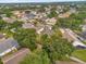 Neighborhood aerial view showcases the property's location in a community with mature trees and well-maintained homes at 608 Wechsler Cir, Orlando, FL 32824