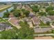 This aerial view highlights the property's location near a highway, a lake, and within a quiet neighborhood at 608 Wechsler Cir, Orlando, FL 32824