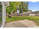 Spacious backyard featuring a lawn, wooden fence, and concrete patio, perfect for outdoor activities and relaxation at 608 Wechsler Cir, Orlando, FL 32824