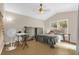 Neutral bedroom with large window and fan at 608 Wechsler Cir, Orlando, FL 32824