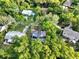 Beautiful aerial view of a neighborhood with lush green trees, manicured lawns, and charming single-Gathering homes at 7043 Carlene Dr, Orlando, FL 32835