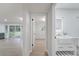 Modern bathroom with a sleek vanity, farmhouse sink, illuminated mirror, and wood-look floors at 7043 Carlene Dr, Orlando, FL 32835