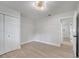 Bright bedroom with wood floors, closet, and access to the hallway at 7043 Carlene Dr, Orlando, FL 32835