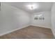 Spacious bedroom features modern flooring, neutral walls, and a bright window at 7043 Carlene Dr, Orlando, FL 32835