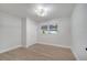 A bedroom with wood-look floors, a closet, a window, and modern light fixture at 7043 Carlene Dr, Orlando, FL 32835