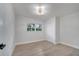 Bright bedroom with wood floors, closet, and modern ceiling light at 7043 Carlene Dr, Orlando, FL 32835