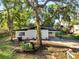 A charming single-story home with a well-maintained lawn and mature trees at 7043 Carlene Dr, Orlando, FL 32835