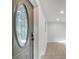Stylish front door with decorative oval glass and sleek hardware at 7043 Carlene Dr, Orlando, FL 32835