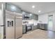 Newly renovated kitchen with stainless steel appliances and modern white countertops at 7043 Carlene Dr, Orlando, FL 32835