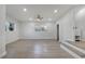 Bright, airy living room with light wood floors, recessed lighting, and large windows at 7043 Carlene Dr, Orlando, FL 32835