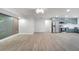 Open floor plan with modern kitchen featuring stainless steel appliances, and a large living area at 7043 Carlene Dr, Orlando, FL 32835