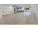 Open-concept living room with a modern kitchen featuring stainless steel appliances and an eat-in counter at 7043 Carlene Dr, Orlando, FL 32835