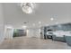 Spacious open floor plan with modern kitchen featuring stainless steel appliances and ample storage at 7043 Carlene Dr, Orlando, FL 32835