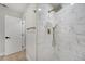 Updated shower with new fixtures, modern tile, and glass door at 7043 Carlene Dr, Orlando, FL 32835