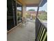 Relaxing balcony featuring seating and views of the neighborhood; perfect for enjoying the outdoors at 746 Terra Lago St, Davenport, FL 33897