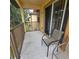 Relaxing outdoor balcony with seating overlooking a serene green space, perfect for enjoying the fresh air at 746 Terra Lago St, Davenport, FL 33897