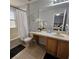 Bright bathroom featuring a vanity with storage, a neutral color palette, and a shower-tub combination at 746 Terra Lago St, Davenport, FL 33897