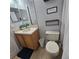 Functional bathroom with a single vanity, neutral tile floors, and a toilet at 746 Terra Lago St, Davenport, FL 33897