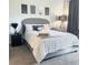 Bedroom featuring neutral décor, including gray walls and carpeting, with a queen bed with decorative pillows at 746 Terra Lago St, Davenport, FL 33897