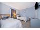 This cozy bedroom features two twin beds, grey walls, and tasteful décor at 746 Terra Lago St, Davenport, FL 33897
