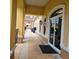 Exterior view of a yellow commercial building featuring an arched glass door at 746 Terra Lago St, Davenport, FL 33897