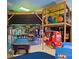 Game room with pool table, air hockey, and arcade games providing entertainment for all ages at 746 Terra Lago St, Davenport, FL 33897