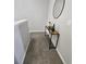 Hallway featuring carpet flooring, a stylish console table with a mirror, and fresh decor adding a touch of elegance at 746 Terra Lago St, Davenport, FL 33897