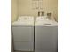 Functional laundry room with a side-by-side washer and dryer for convenient laundry days at 746 Terra Lago St, Davenport, FL 33897