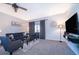 Comfortable living room with plush seating, a sleek entertainment center, and neutral decor at 746 Terra Lago St, Davenport, FL 33897