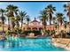 Resort-style pool with palm trees, water features, and lounge chairs for relaxation and vacation vibes at 746 Terra Lago St, Davenport, FL 33897