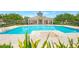 Community pool and clubhouse area with lounge chairs and nearby clubhouse facilities at 7621 Sutherton Ln, Windermere, FL 34786