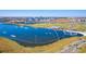 Fantastic aerial view of the community's lake, watersport, and recreational amenities and its close proximity to businesses at 9121 Laureate Blvd, Orlando, FL 32827