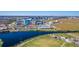 Community sports facilities and lake, set against a backdrop of offices and businesses at 9121 Laureate Blvd, Orlando, FL 32827