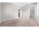 Bedroom with neutral walls, carpet flooring, and walk-in closet at 9121 Laureate Blvd, Orlando, FL 32827