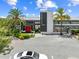 The Canvas Restaurant & Market exterior is adorned with colorful artistic touches and lush landscaping for a vibrant setting at 9121 Laureate Blvd, Orlando, FL 32827