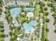 Aerial view of the multiple community pools surrounded by lush landscaping and amenities at 9121 Laureate Blvd, Orlando, FL 32827