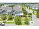 Inviting two-story home boasts charming curb appeal with lush landscaping and craftsman architectural details at 9121 Laureate Blvd, Orlando, FL 32827