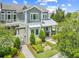 Stunning two-story home boasting exceptional curb appeal with beautifully manicured landscaping and craftsman architecture at 9121 Laureate Blvd, Orlando, FL 32827