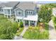 Charming two-story home showcasing a welcoming front porch and a beautifully landscaped front yard at 9121 Laureate Blvd, Orlando, FL 32827
