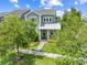 Beautiful home with a covered porch and lush green landscape at 9121 Laureate Blvd, Orlando, FL 32827